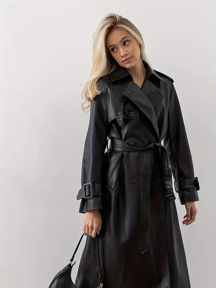 Women’s long black faux-leather trench coat with belted waist and double-breasted design