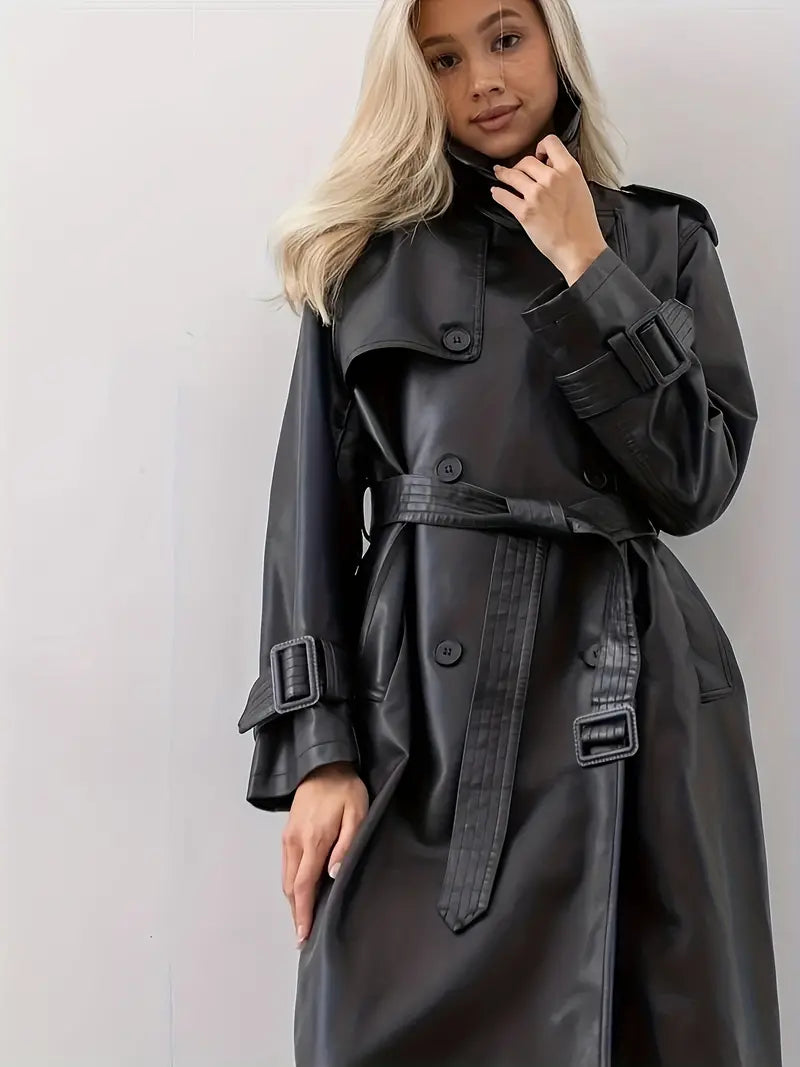 Women’s long black faux-leather trench coat with belted waist and buckle details on sleeves