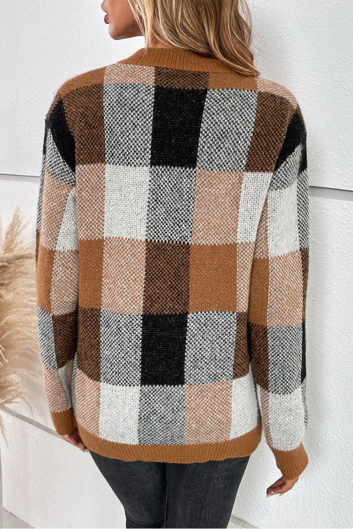 Back view of women’s long-sleeve plaid sweater in brown, black and beige
