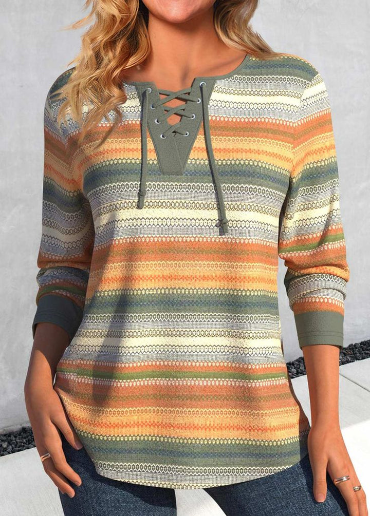 Women’s long-sleeve top with lace-up neckline and multicolour striped pattern in green and orange tones.