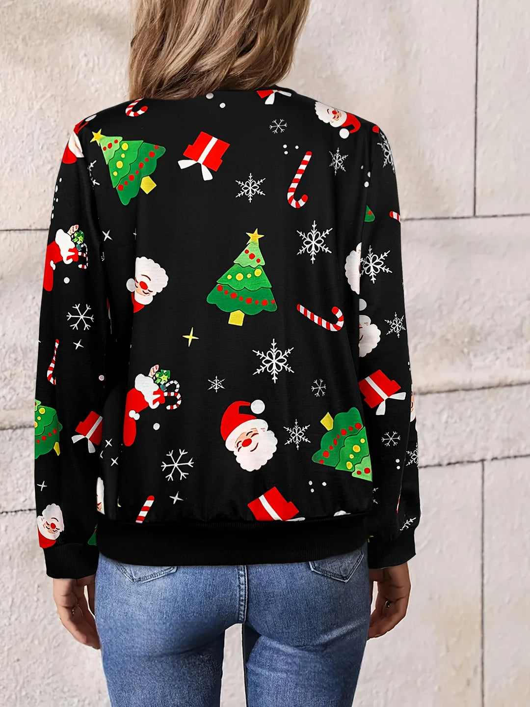 Back view of women’s black Christmas jacket with Santa, gift and tree holiday pattern.